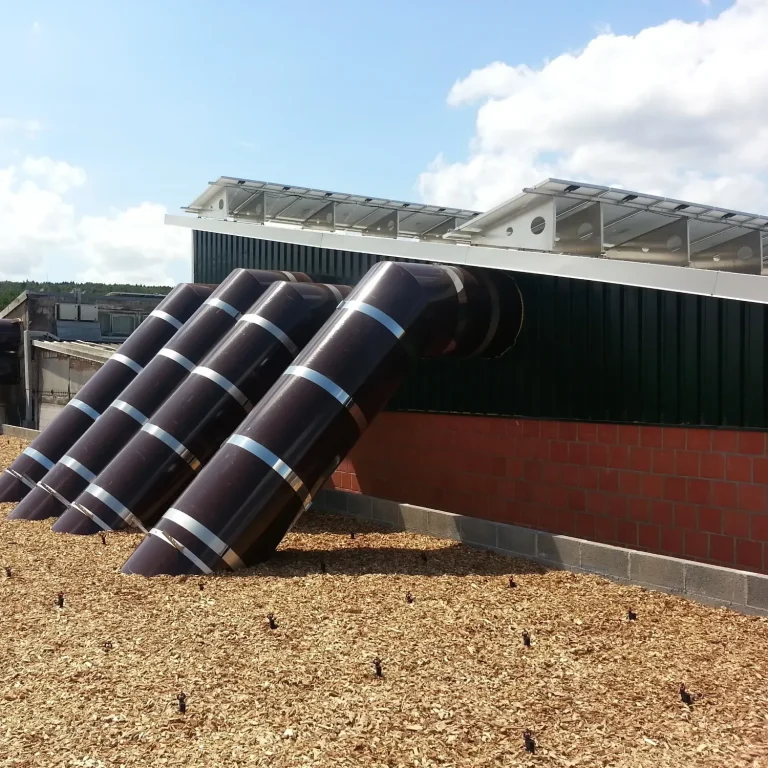 A biofilter installed in a concrete basin, designed for efficient exhaust air treatment in livestock farming, reducing odors and emissions.